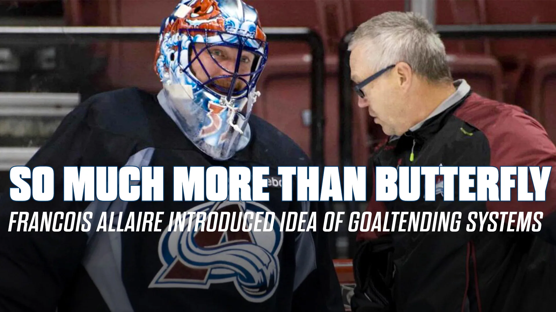 Colorado Avalanche goalie in colorful mask talks with goaltending coach François Allaire during a stoppage in play.