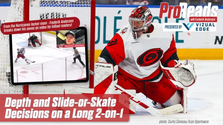 Hurricanes goalie Frederik Andersen in red set position tracking a 2-on-1 rush, wearing Carey Price-style mask