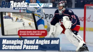 Columbus Blue Jackets goalie Jet Greaves in butterfly position tracking a screened pass in full gear