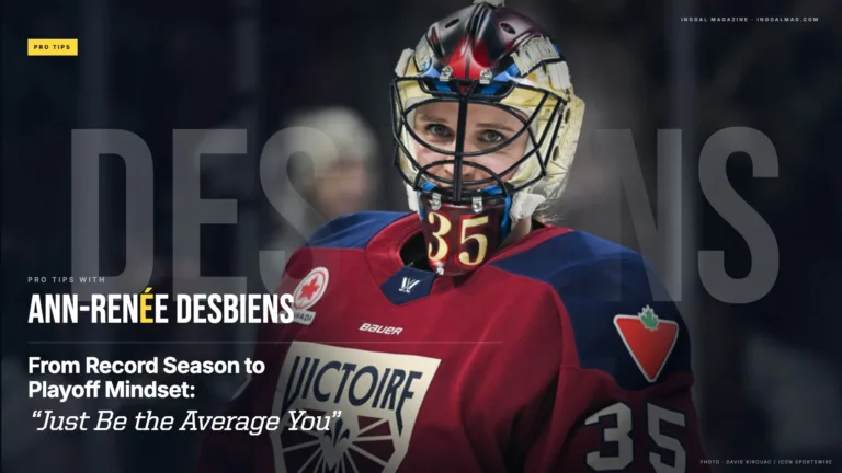 Ann-Renée Desbiens in red Canada uniform wearing Victoire-branded gear and #35 mask, posed in portrait