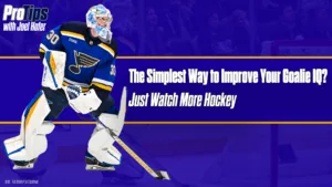 Blues goalie Joel Hofer in stance wearing full gear, St. Louis Blues blue and gold uniform, number 30, ready position on ice
