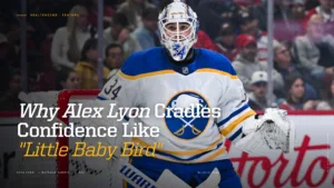Buffalo Sabres goalie Alex Lyon in white jersey and blue mask in ready position during an NHL game