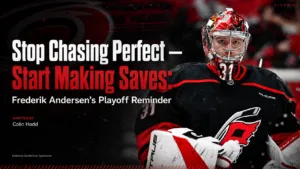 Frederik Andersen Carolina Hurricanes goalie in red mask and black jersey, focused expression, number 31