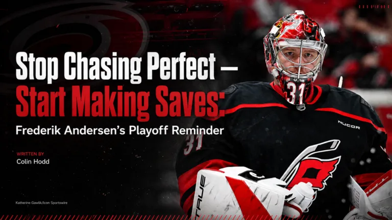 Frederik Andersen Carolina Hurricanes goalie in red mask and black jersey, focused expression, number 31