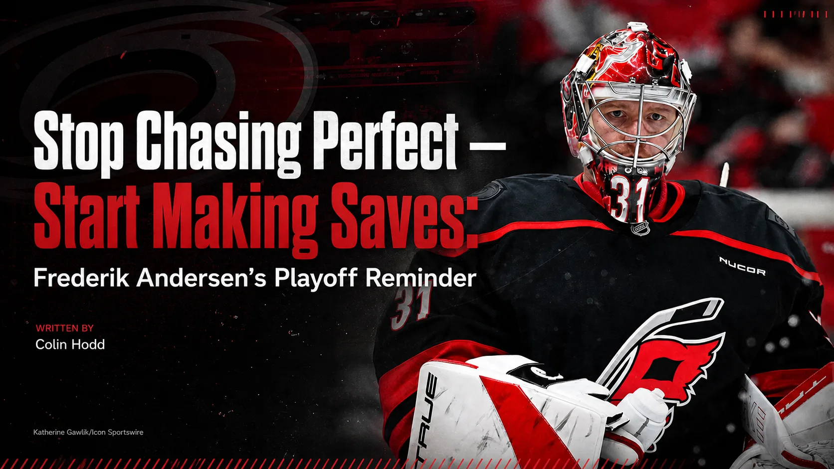 Frederik Andersen Carolina Hurricanes goalie in red mask and black jersey, focused expression, number 31