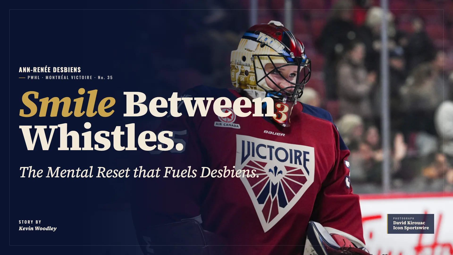 Ann-Renée Desbiens in PWHL Montreal red jersey smiling during stoppage, wearing full goalie gear including mask and blocker