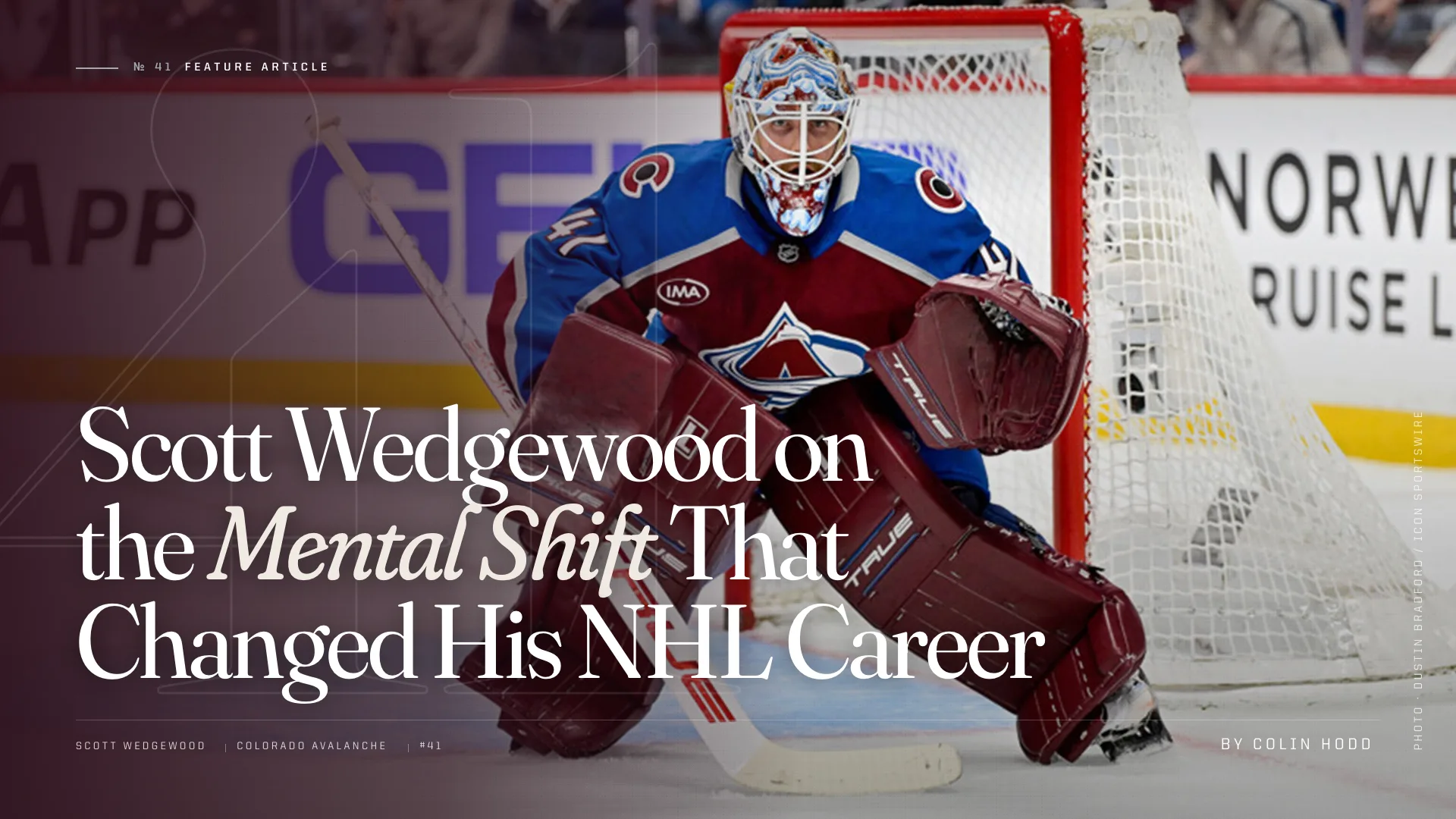 Scott Wedgewood in Colorado Avalanche gear in his crease, poised in butterfly stance ready to make a save.