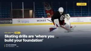Dylan Garand in Columbus Blue Jackets gear practicing skating drills on ice, in a low athletic stance during off-season tr...