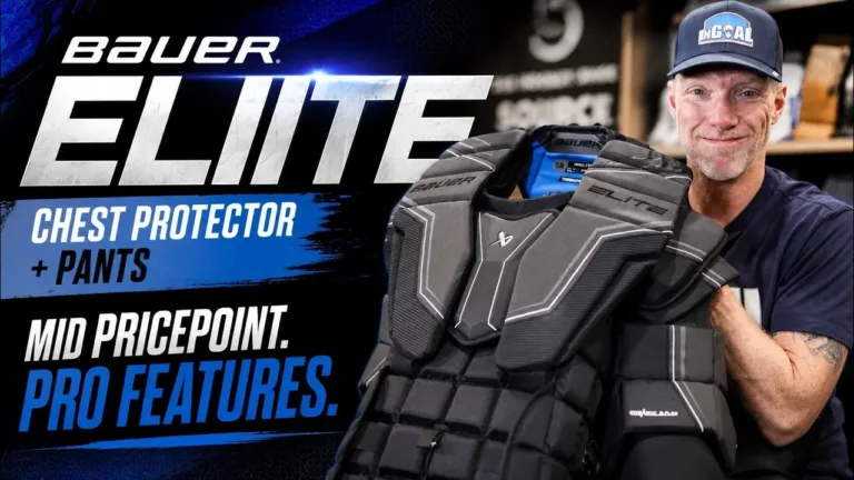 Man holding Bauer Elite goalie chest protector and pants combo, showcasing the mid-pricepoint protective gear