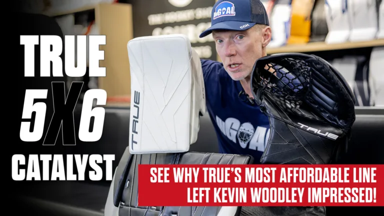 Kevin Woodley holding True Catalyst 5X6 goalie glove and blocker during gear review