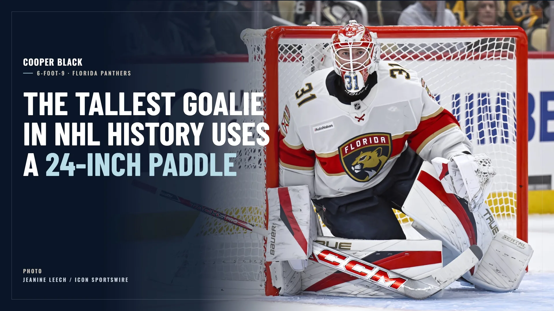 Florida Panthers goalie Cooper Black in white CCM gear making a save in butterfly position on the ice
