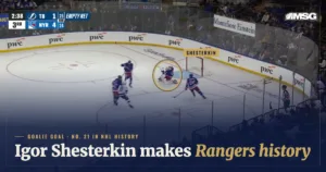 Igor Shesterkin on his knees after shooting the puck the length of the ice into Tampa Bay’s empty net at Madison Square Garden